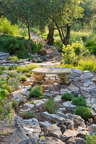 PRIVATE_VILLA__CORFU__GREECE_DESIGN_BY_ALITHEA_JOHNS__STONE_AND_GRAVEL_PATH_THROUGH_WOODLAND_WITH_ST