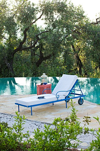 VILLA_ONEIRO__CORFU__DESIGNER_GINA_PRICE_VIEW_ACROSS_THE_SWIMMING_POOL_WITH_SUN_LOUGERS_FROM_MOROCCO
