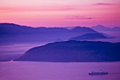 THE ROU ESTATE  CORFU: VIEW ACROSS TO ALABANIAN MOUNTAINS AT DAWN WITH CRUISE SHIP