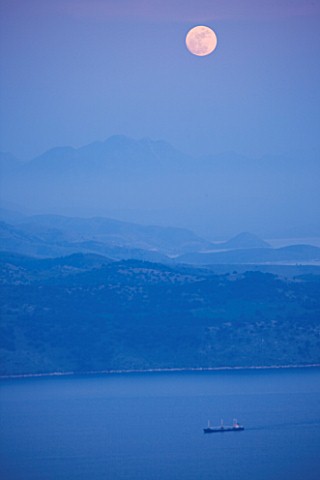THE_ROU_ESTATE__CORFU_VIEW_ACROSS_TO_ALABANIAN_MOUNTAINS_AND_SHIP_WITH_MOON