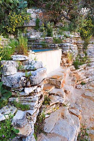 THE_ROU_ESTATE__CORFU_THE_SWIMMING_POOL_AREA__ROCK_FACE_BESIDE_THE_PLUNGE_POOL