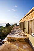 THE ROU ESTATE  CORFU: EXTERIOR OF APARTMENT/VILLA WITH SHUTTERS AND VIEW OUT TO SEA