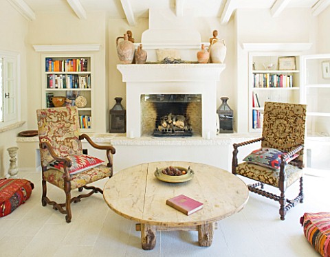 THE_ROU_ESTATE__CORFU_LIVING_AREA_WITH_WOODEN_COFFEE_TABLE__UPHOLSTERED_CHAIRS_AND_FIREPLACE