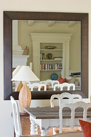 THE_ROU_ESTATE__CORFU_HUGE_MIRROR_IN_DINING_AREA_WITH_TABLE_AND_CHAIRS