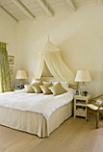 THE KAPARELLI ESTATE  CORFU - BEDROOM WITH IVORY DRAPES OVER BED
