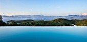 THE KAPARELLI ESTATE  CORFU - VIEW OVER INFINITY SWIMMING POOL OUT TO SEA WITH ALBANIAN MOUNTAINS BEYOND