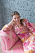 JOA STUDHOLMES LONDON HOME: JOA RELAXING ON HER PINK SOFA IN THE LIVING ROOM