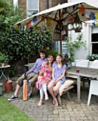 JOA STUDHOLMES LONDON HOME: JOA AND FAMILY RELAX IN THE GARDEN