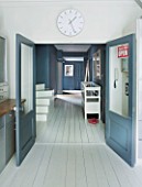 JOA STUDHOLMES LONDON HOME: HALLWAY WITH WHITE PAINTED WOODEN FLOOR