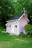 PAULA PRYKES HOUSE  SUFFOLK: PINK PAINTED PLAYHOUSE/SUMMERHOUSE MADE BY LOCAL CARPENTER/CRAFTSMAN