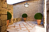 LA CARMEJANE, FRANCE: LUBERON, PROVENCE, TERRACE, PATIO WITH TERRACOTTA CONTAINERS, BOX, BUXUS, CLIPPED, TOPIARY, FRENCH, COUNTRY, GARDEN, LIGHT
