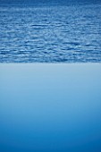 CORFU  GREECE: DESIGNER: DOMINIC SKINNER - MEDITTERANEAN STYLE GARDEN  - INFINITY POOL LOOKING OUT ACROSS THE SEA