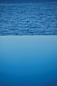 CORFU  GREECE: DESIGNER: DOMINIC SKINNER - MEDITTERANEAN STYLE GARDEN  - INFINITY POOL LOOKING OUT ACROSS THE SEA