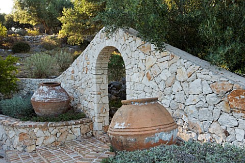 PRIVATE_VILLA__CORFU__GREECE_DESIGN_BY_ALITHEA_JOHNS__BRICK_STEPS_LEADING_THROUGH_STONE_ARCH_WITH_TW