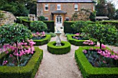 THE OLD RECTORY  HASELBECH  NORTHAMPTONSHIRE: THE KNOT GARDEN WITH SUNDIAL  BOX EDGED BEDS PLANTED WITH NERINE BOWDENII