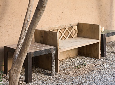 DESIGNERS_ERIC_OSSART_AND_ARNAUD_MAURIERES__MOROCCO_AL_HOSSOUN__GRAVEL_COURTYARD_WITH_WOODEN_BENCH__