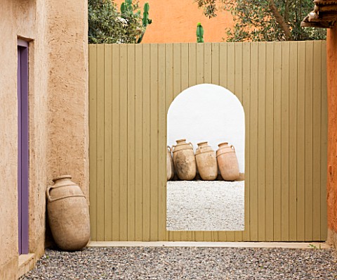 DESIGNERS_ERIC_OSSART_AND_ARNAUD_MAURIERES__MOROCCO__AL_HOSSOUN__COURTYARDS_WITH_WOODEN_FENCE_AND_GA