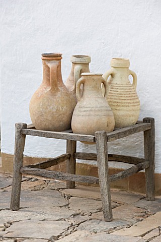 DESIGNERS_ERIC_OSSART_AND_ARNAUD_MAURIERES__MOROCCO_AL_HOSSOUN__TERRACOTTA_CONTAINERS_AGAINST_A_WHIT