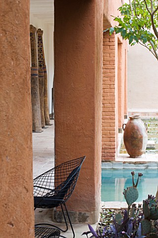 DESIGNERS_ERIC_OSSART_AND_ARNAUD_MAURIERES__MOROCCO_AL_HOSSOUN__COURTYARD_BY_RECTANGULAR_POOL_WITH_S