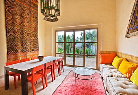 DESIGNERS_ERIC_OSSART_AND_ARNAUD_MAURIERES__MOROCCO_AL_HOSSOUN__LIVING_ROOM_WITH_ORANGE_AND_YELLOW_C