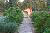 DESIGNERS ERIC OSSART AND ARNAUD MAURIERES  MOROCCO: DAR IGDAD - BORDER OF FIGS WITH PATH TO EARTH WALL