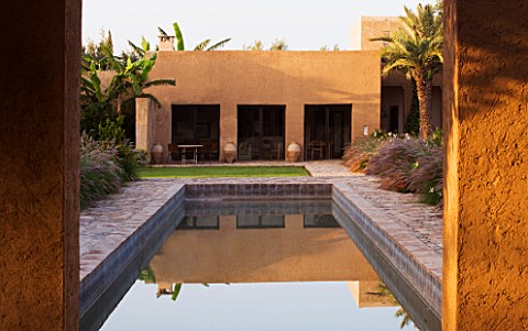 DESIGNERS_ERIC_OSSART_AND_ARNAUD_MAURIERES__MOROCCO_DAR_IGDAD__SWIMMING_POOL_AND_RAMMED_EARTH_BUILDI
