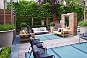 ROOF GARDEN BY STEPHEN WOODHAMS, LONDON: TERRACE/SEATING AREA WITH WOODEN BENCHES, BOX BALLS IN CONTAINERS, DECKING WITH FROSTED GLASS SKYLIGHTS, SCREEN, MIRROR, PLEACHED HORNBEAMS, DECKS, DECKING, DECKED