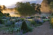 NARBOROUGH HALL  NORFOLK: DAWN LIGHT ON THE RIVER NAR AND THE GRAVEL GARDEN IN FRONT OF THE HALL