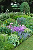 NARBOROUGH HALL  NORFOLK: THE PASTEL BORDER WITH FENNEL  POPPIES AND ALCHEMILLA MOLLIS