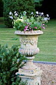 NARBOROUGH HALL  NORFOLK: A STONE URN IN THE PASTEL BORDER