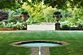 PRIVATE GARDEN, COTSWOLDS: DESIGNER ALISON HENRY - LAWN AND RILL TO FORMAL ROUND POND / POOL - LAWN, STONE PIERS WITH URNS, CONTAINERS, FORMAL, WATER, CLASSIC,  ENGLISH,  GARDEN