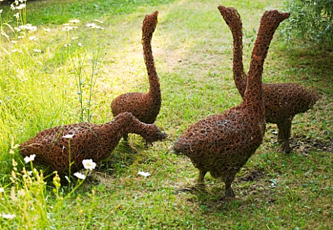 DESIGNER_ALISON_HENRY__PRIVATE_GARDEN_COTSWOLDS_MEADOW_AND_GRASS_PATH_WITH_WILLOW_GEESE_SCULPTURE_BY