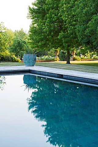 PRIVATE_GARDEN_COTSWOLDS_DESIGNER_ALISON_HENRY__LAWN_SWIMMING_POOL_BRONZE_CONTAINER_WITH_CORDYLINE_F