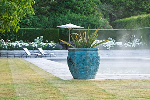 PRIVATE_GARDEN_COTSWOLDS_DESIGNER_ALISON_HENRY__LAWN_SWIMMING_POOL_BRONZE_CONTAINER_WITH_CORDYLINE_F