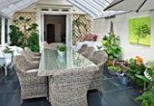 DESIGNER CLARE MATTHEWS: CONSERVATORY WITH WICKER TABLE AND CHAIRS