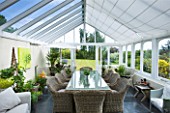 DESIGNER CLARE MATTHEWS - CONSERVATORY WITH WICKER TABLE AND CHAIRS