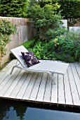 DESIGNER CHARLOTTE ROWE, LONDON: SMALL, TOWN, CITY, GARDEN, DECKS, DECKING, WATER, POND, POOL, SUN, LOUNGERS, SEATS, FENCES, FENCING, CUSHIONS