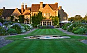 WHATLEY MANOR  WILTSHIRE: VIEW ACROSS THE MAIN LAWN TO THE MANOR WITH ROUND POND