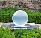 WHATLEY MANOR  WILTSHIRE: THE KNOT GARDEN WITH BOX BALLS AND A WATER FEATURE BY ALISON ARMOUR-WILSON