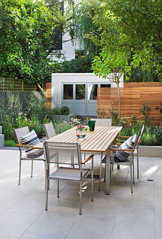 JARDINROSAINSPIRATIONS__SMALL_TOWN_GARDEN_WHITE_PORCELAIN_TILED_DINING_AREA_PATIOTABLE_AND_CHAIRS__A