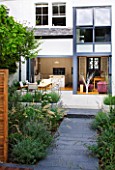 @JARDINROSAINSPIRATIONS - SMALL TOWN GARDEN: VIEW FROM BACK OF GARDEN TO HOUSE WITH PORCELAIN PATIO AND KITCHEN