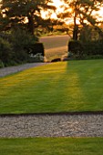 WHATLEY MANOR  WILTSHIRE: VIEW OUT TO THE WILTSHIRE COUNTRYSIDE FROM THE GRAND LAWN  EVENING LIGHT