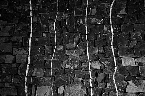 DIGNE_LES_BAINS__FRANCE_BLACK_AND_WHITE_IMAGE_OF_WHITE_LINES_ON_BLACK_ROCK_BY_ANDY_GOLDSWORTHY