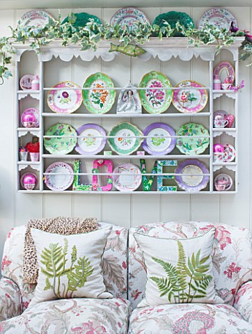 DESIGNER_BUTTER_WAKEFIELD__LONDON__THE_CONSERVATORY__PLATES_IN_CUPBOARD_ON_WALL_WITH_SETTEE_BENEATH