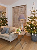 DESIGNER: JACKY HOBBS  LONDON: LIVING ROOM AT CHRISTMAS - SOFA  FAUX FRENCH DOORS  CHRISTMAS TREES