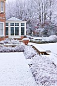 FORMAL TOWN GARDEN IN SNOW  OXFORD  WINTER: DESIGN BY LIZ NICHOLSON - THE FORMAL LAWN AT THE BACK OF THE HOUSE