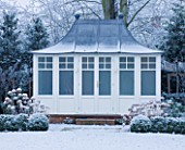 FORMAL TOWN GARDEN IN SNOW  OXFORD  WINTER: DESIGN BY LIZ NICHOLSON - LEAD ROOFED SUMMERHOUSE