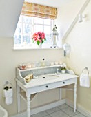 BRUERN COTTAGES  OXFORDSHIRE: CHRISTMAS - BATHROOM WITH MARBLE TOP WASHSTAND SET WITH CANDLES