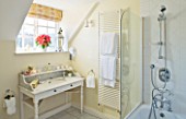 BRUERN COTTAGES  OXFORDSHIRE: CHRISTMAS - BATHROOM WITH MARBLE TOP WASHSTAND SET WITH CANDLES