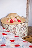 DESIGNER CAROLYN MINTY  GLOUCESTERSHIRE - HAT AND HAT BOX BESIDE BED